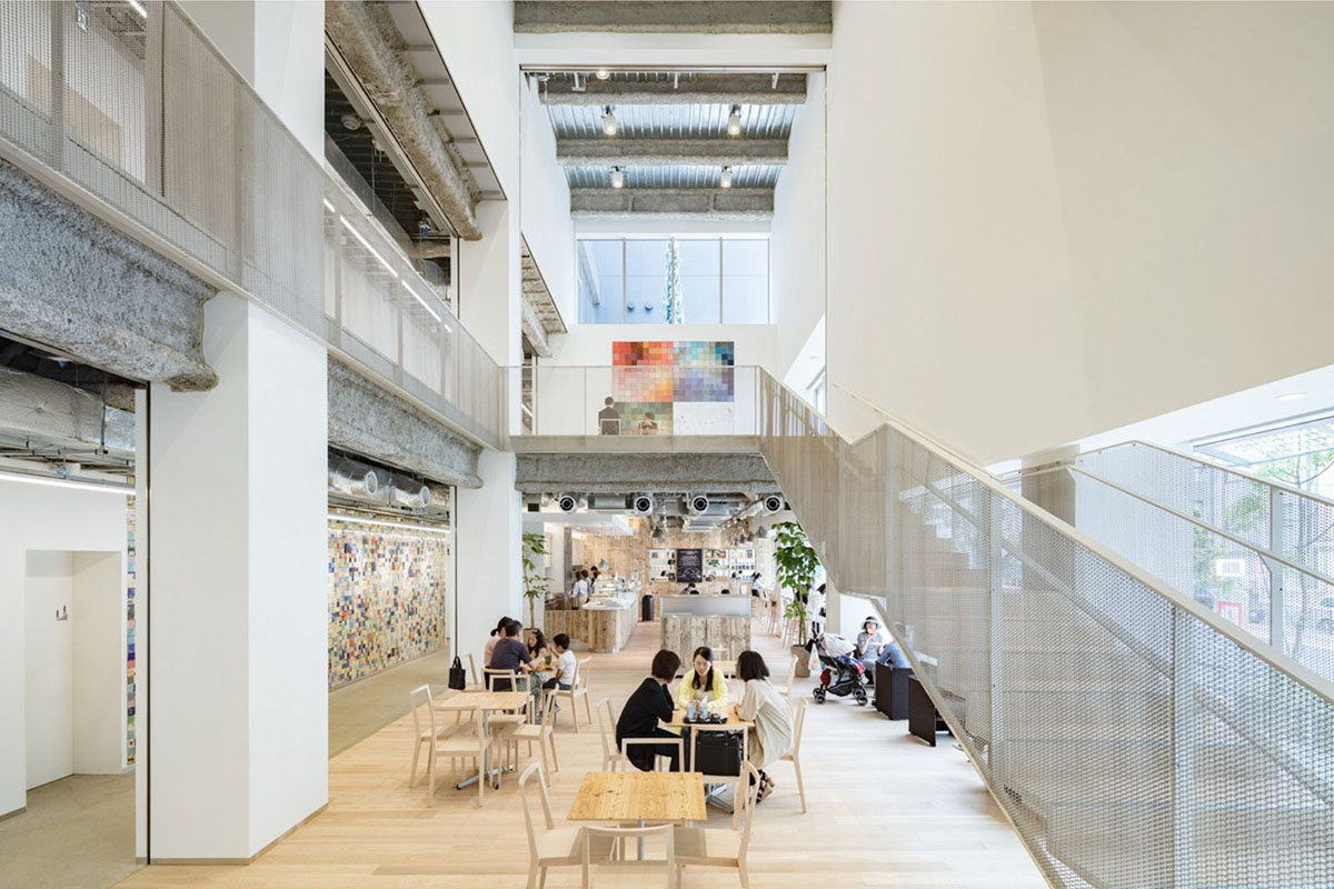 Kengo Kuma wraps alumni building in Tokyo with irregular metal surface creating organic skin