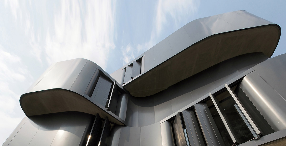 ASWA used physical character of leather to design this curved office building in Bangkok