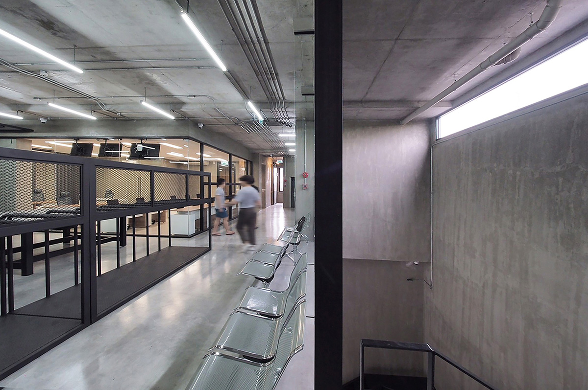 ASWA used physical character of leather to design this curved office building in Bangkok