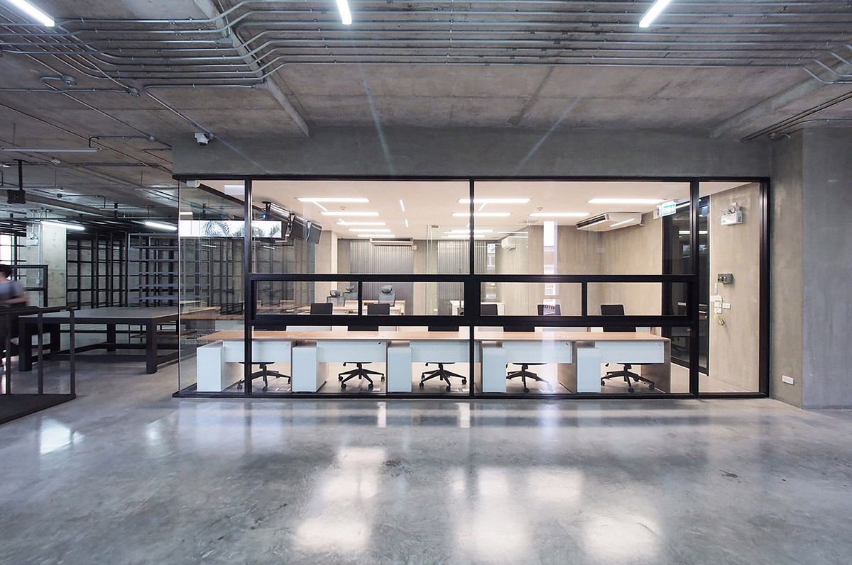 ASWA used physical character of leather to design this curved office building in Bangkok