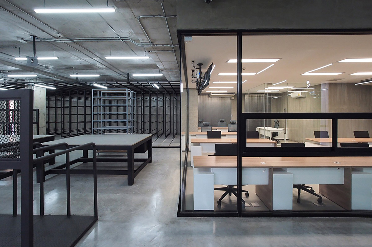 ASWA used physical character of leather to design this curved office building in Bangkok