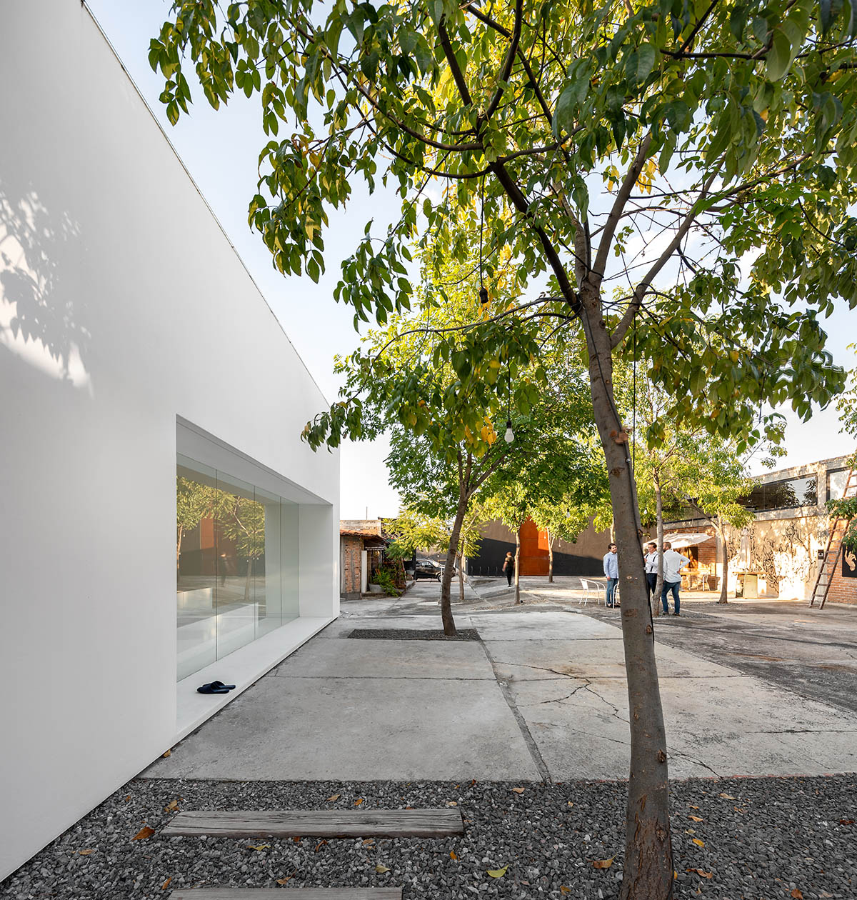 HW Studio Arquitectos converts old wood drying oven into its own studio with all-white colour volume