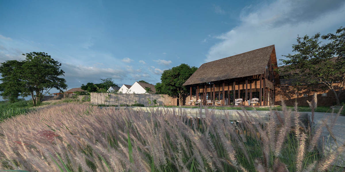 Onion completes rural hotel with private villas within organic fruit and vegetable farms in Thailand