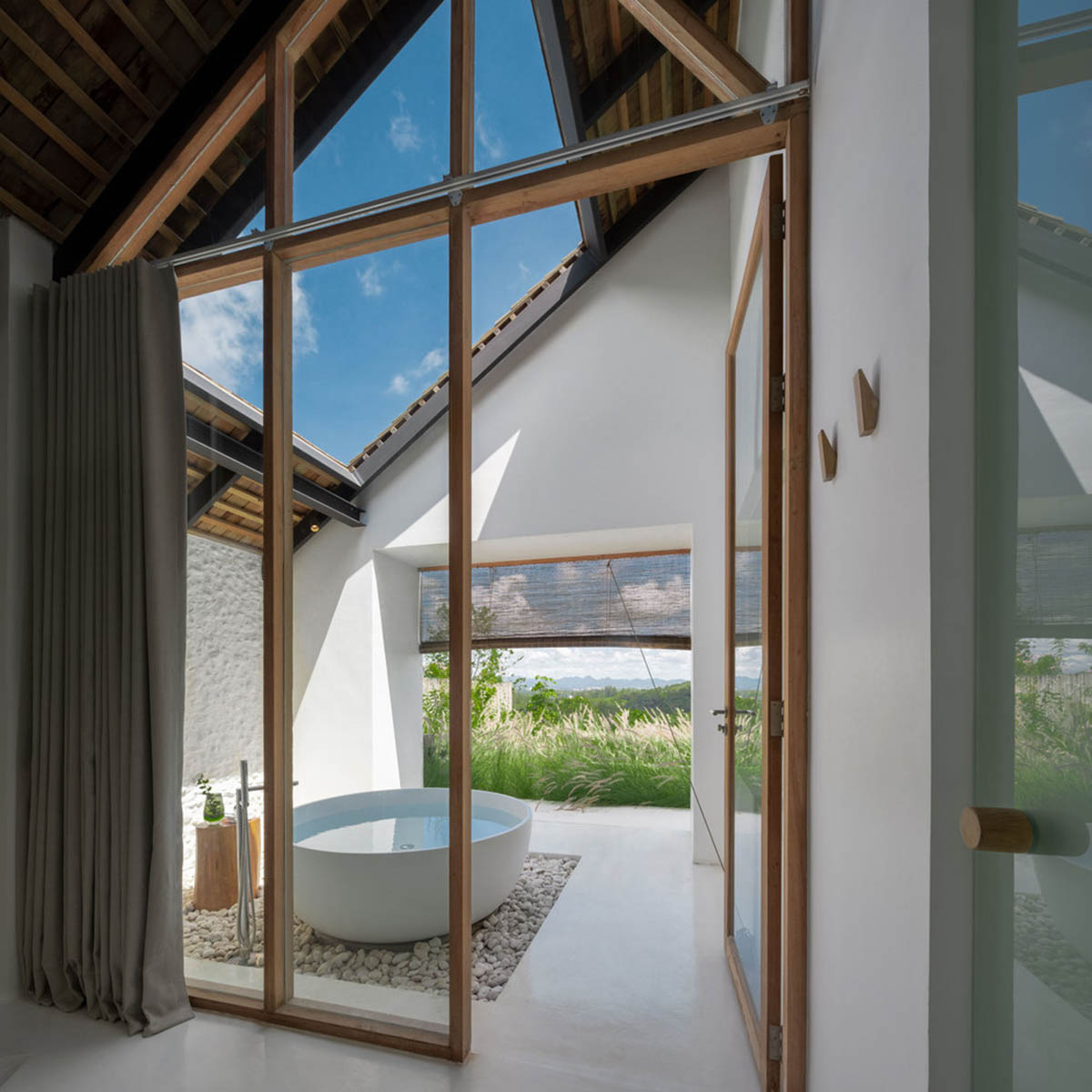 Onion completes rural hotel with private villas within organic fruit and vegetable farms in Thailand