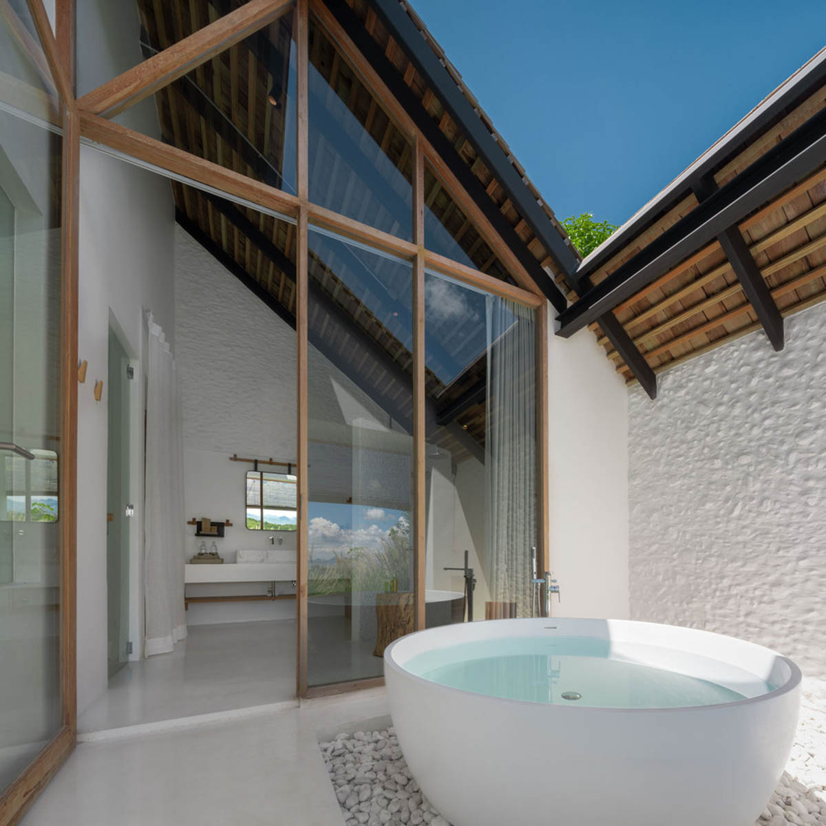 Onion completes rural hotel with private villas within organic fruit and vegetable farms in Thailand