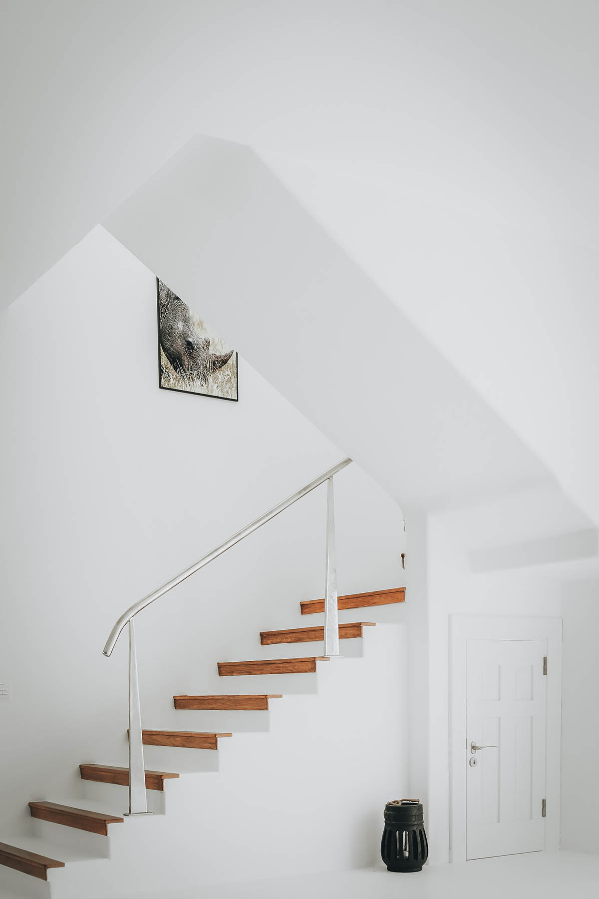 Lava-black landscape and palm trees inform this all-white house by OOOOX in Spain 