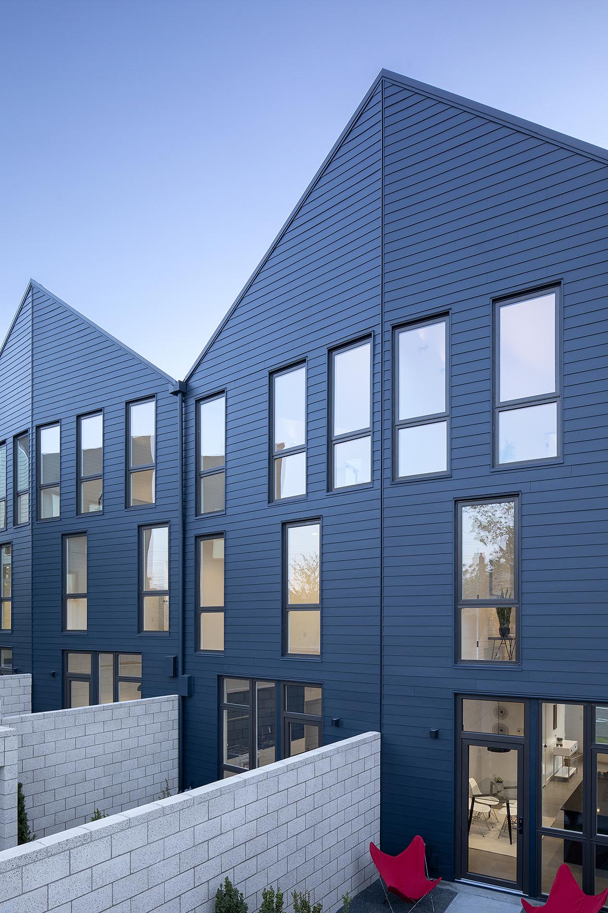 Waechter Architecture completes Origami townhouses with folded facades in Portland
