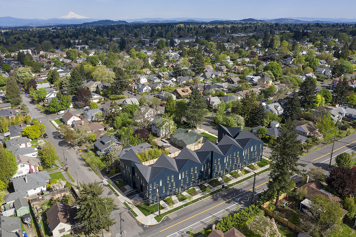 Waechter Architecture completes Origami townhouses with folded facades in Portland