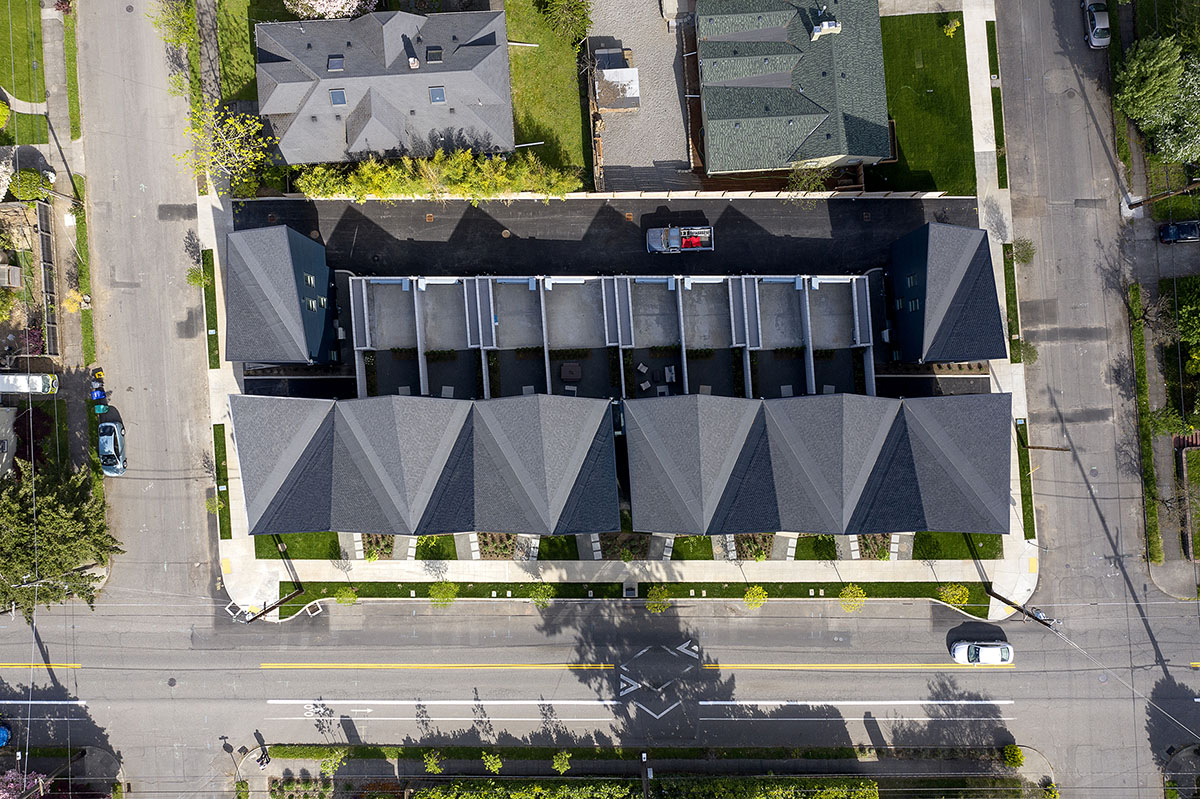 Waechter Architecture completes Origami townhouses with folded facades in Portland