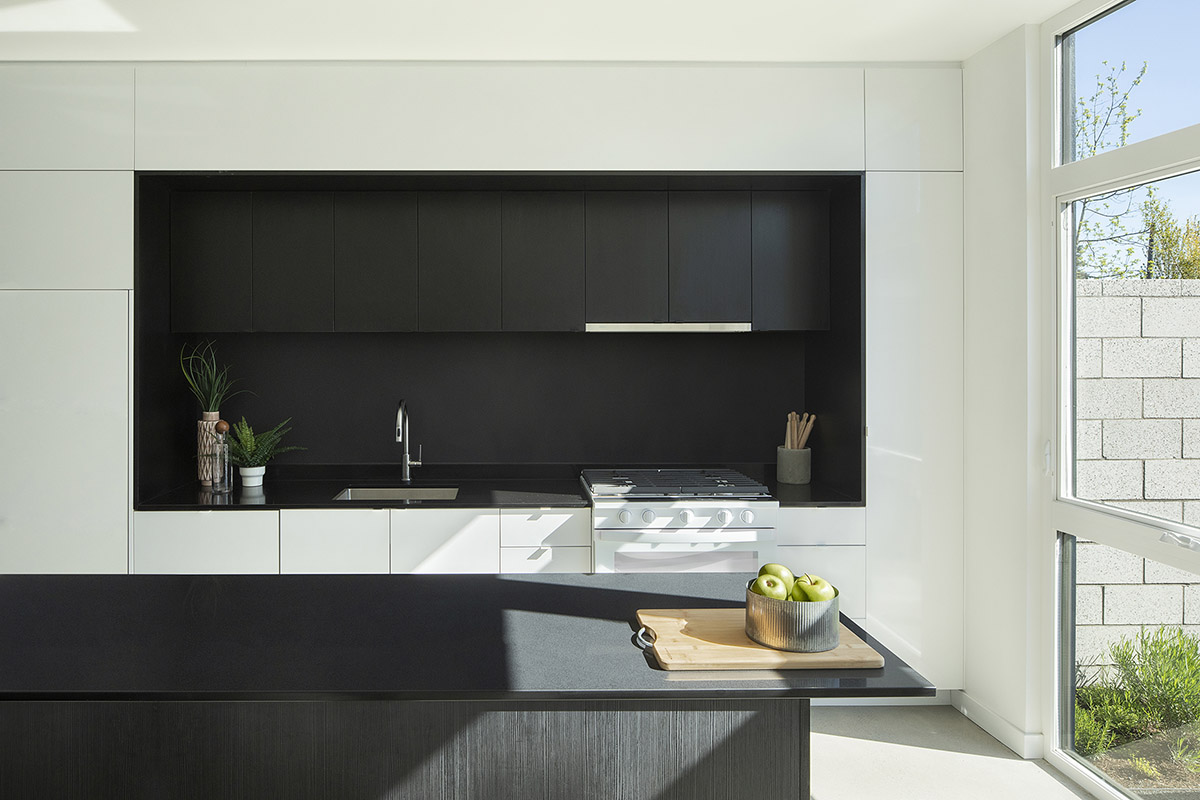 Waechter Architecture completes Origami townhouses with folded facades in Portland