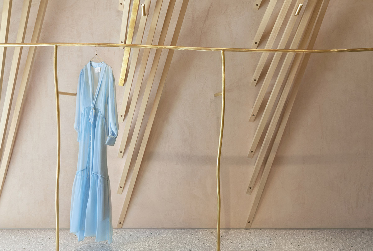 Golden and powder-colored details dominate forte_forte forte dei Marmi boutique in Italy