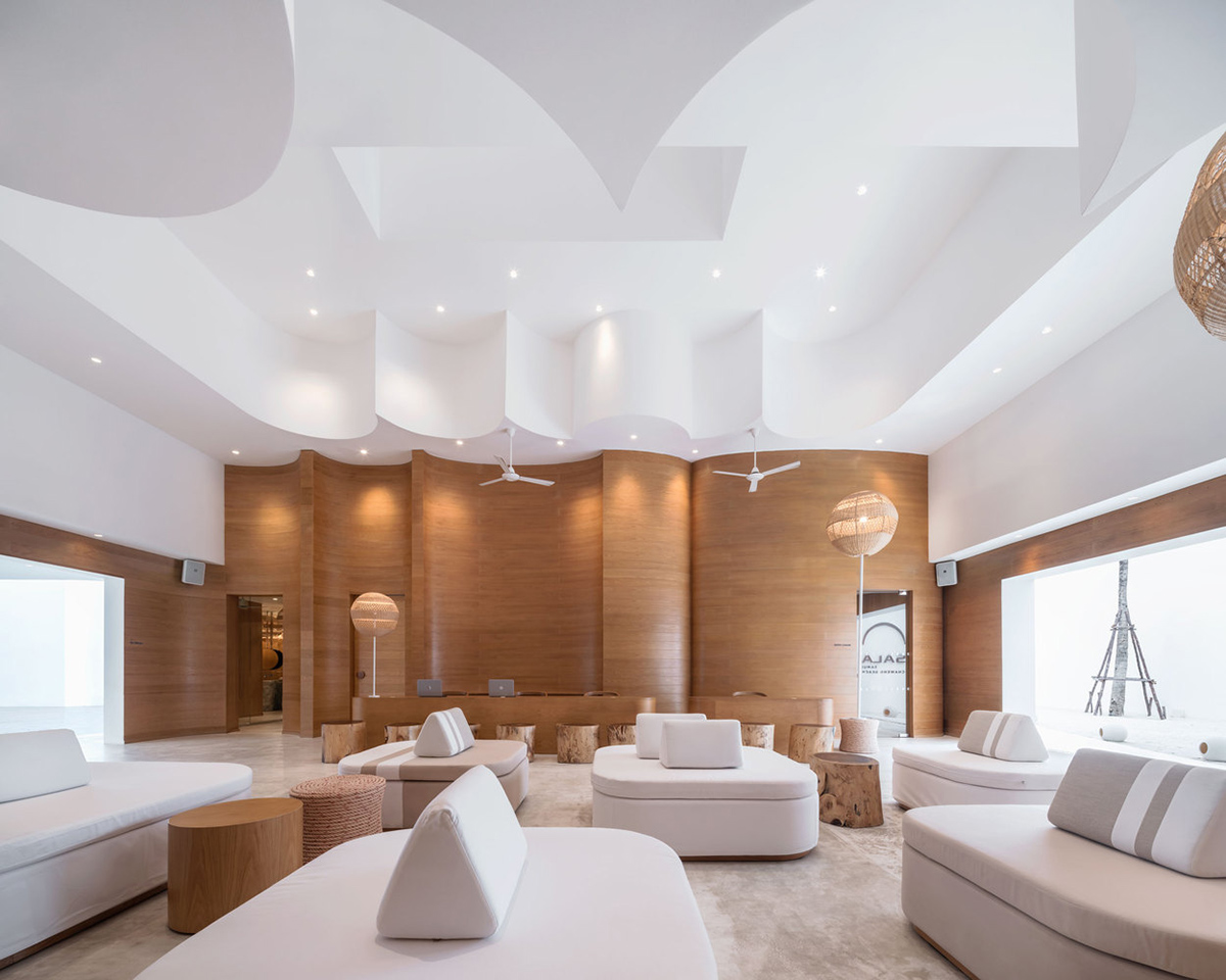 onion combines white concave and convex walls with colorful surfaces for beach resort in Thailand