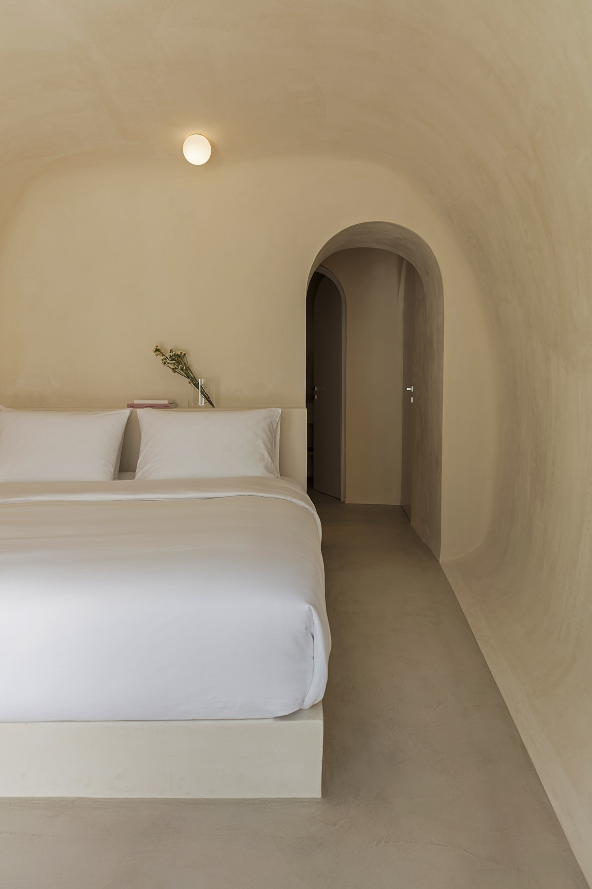 Kapsimalis Architects converts old caved houses into holiday residences on Santorini Island