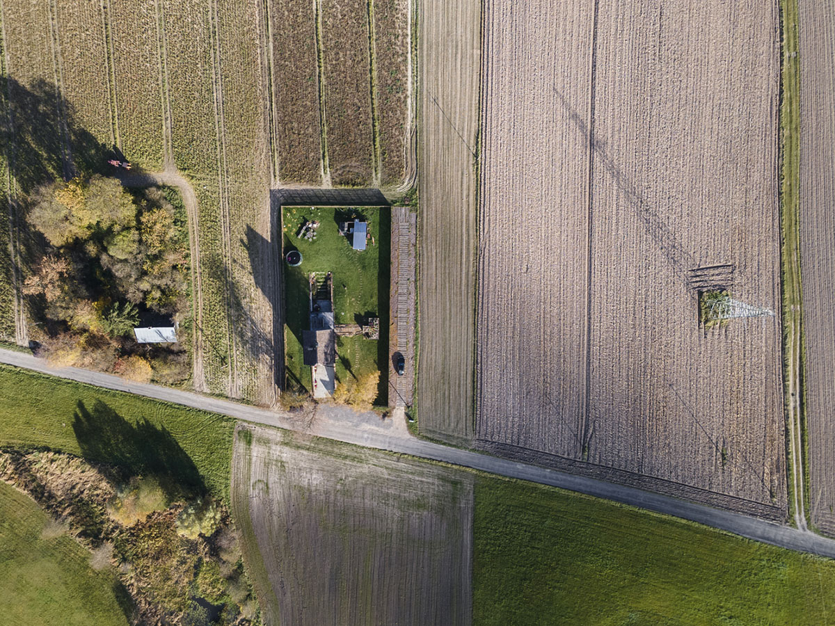 Michał Kucharski and o4 architekci clad old windmill with charred wood in a Polish town 