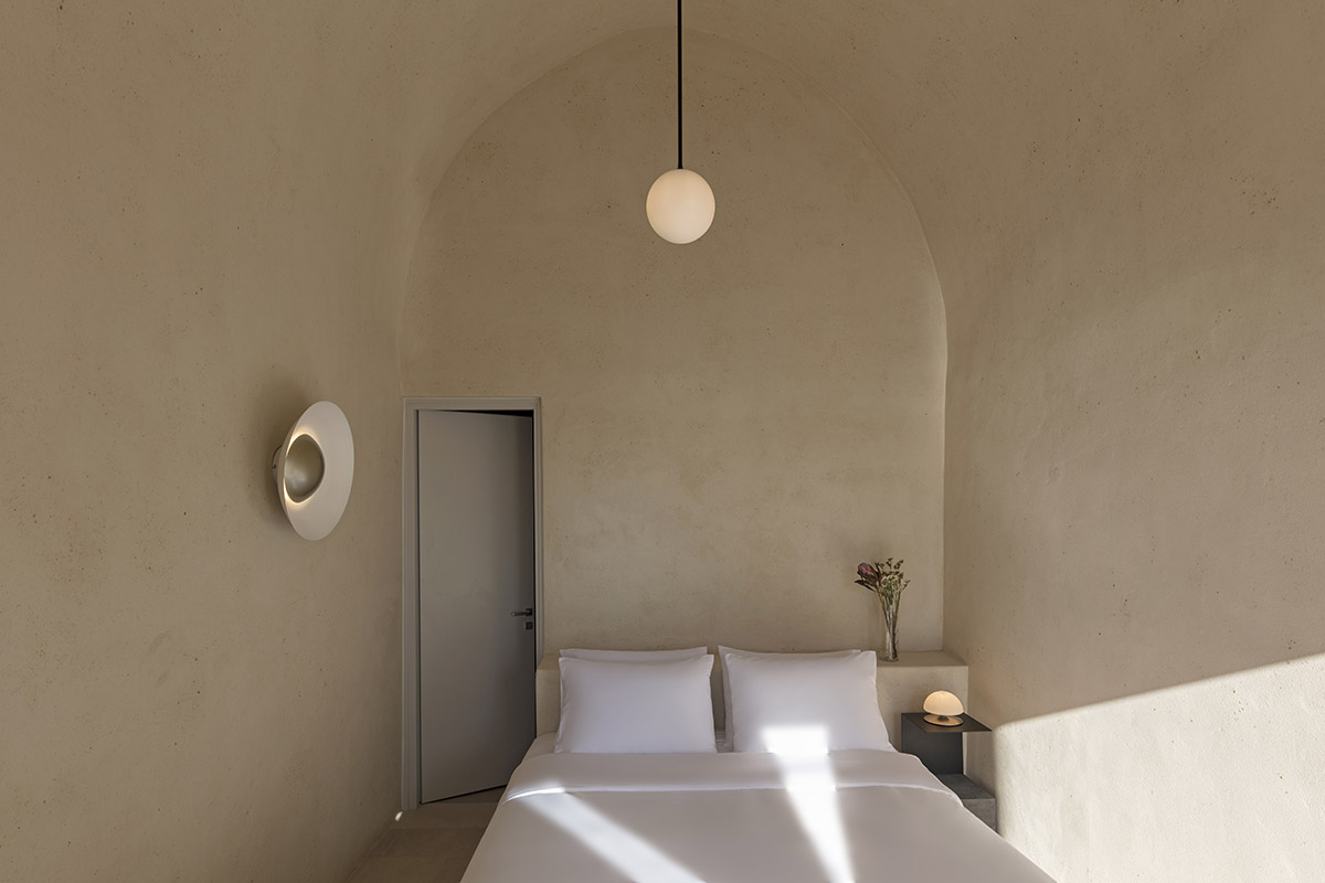 Kapsimalis Architects converts old caved houses into holiday residences on Santorini Island