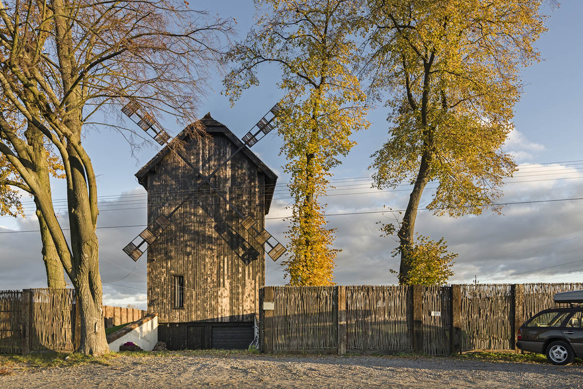 Michał Kucharski and o4 architekci clad old windmill with charred wood in a Polish town 