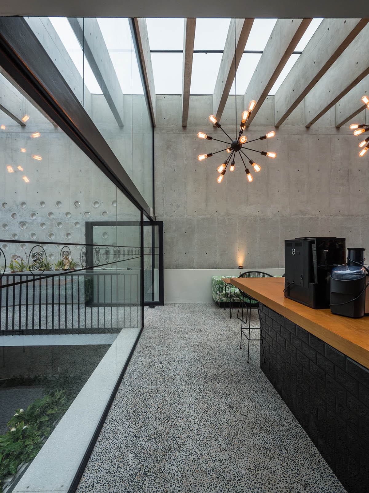 Nómena Arquitectos completes retail and exhibition space with perforated façade in Peru