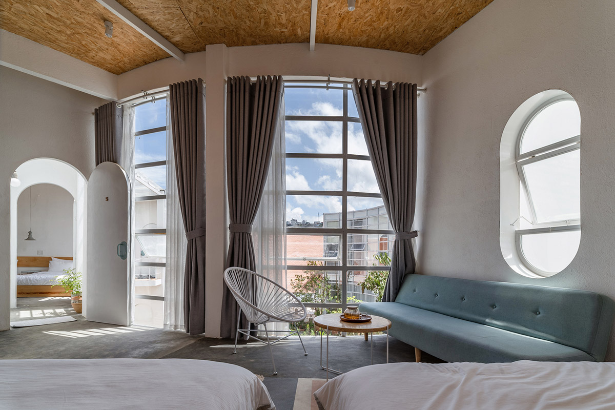 G+ Architects completes all-white circular L00P Boutique Hotel and Café in Vietnam