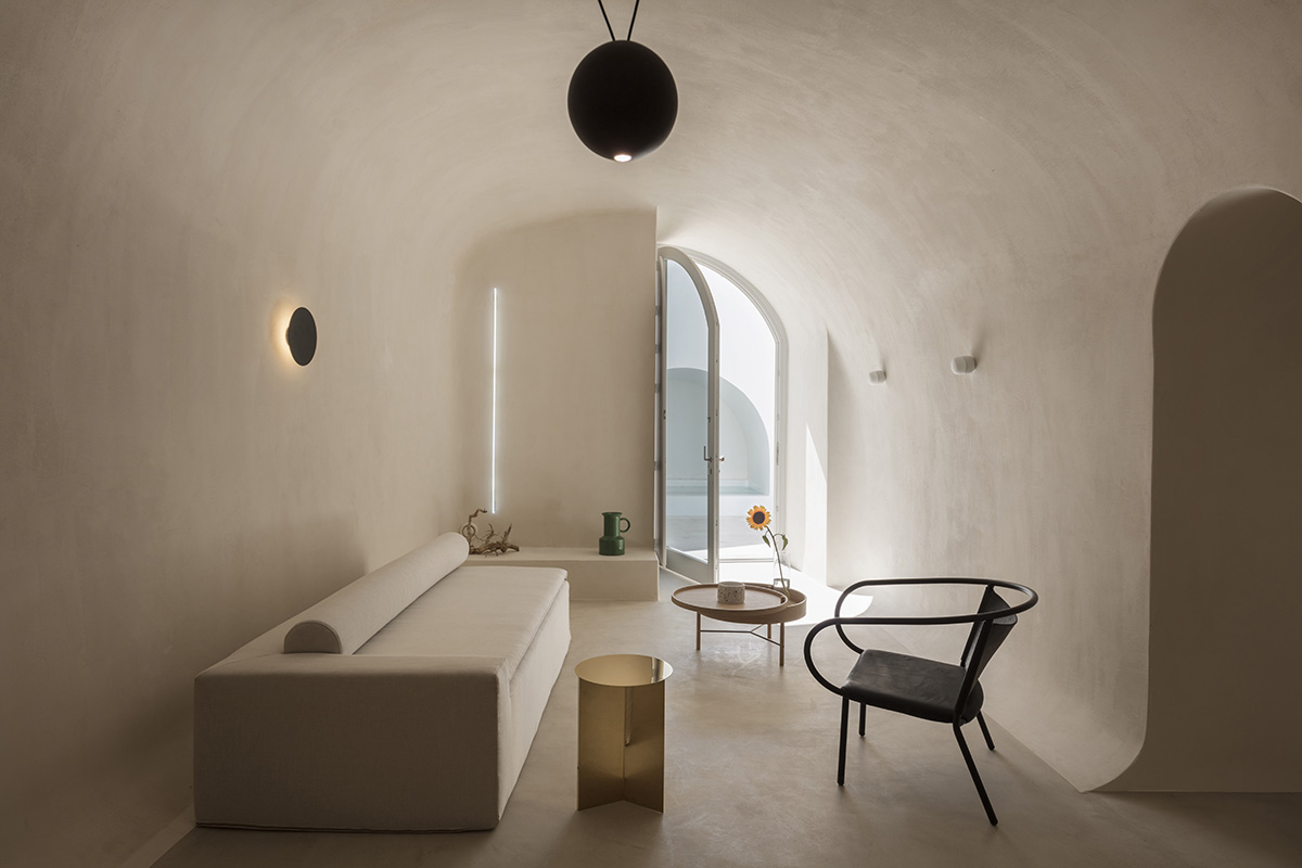 Kapsimalis Architects converts old caved houses into holiday residences on Santorini Island