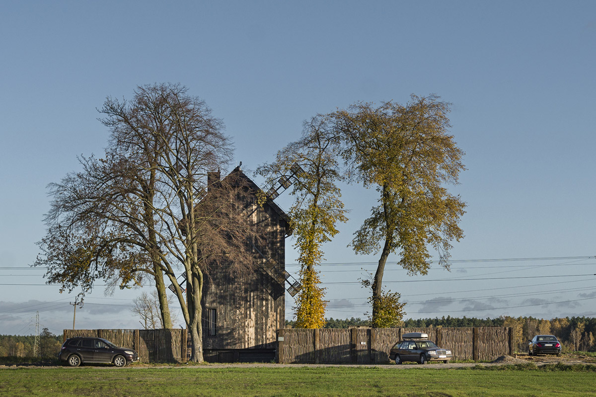 Michał Kucharski and o4 architekci clad old windmill with charred wood in a Polish town 