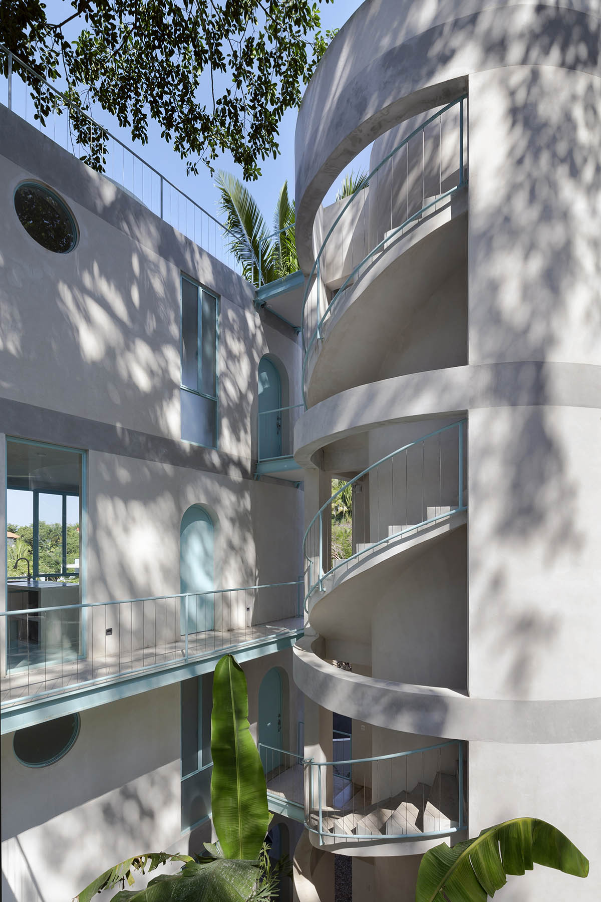 Palma designs a pair of hybrid apartments with creamy tones and light blue additions in Mexico 