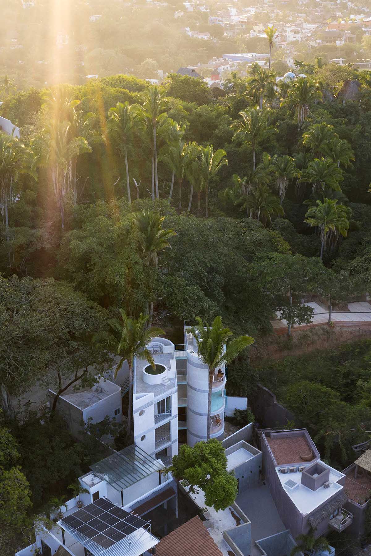 Palma designs a pair of hybrid apartments with creamy tones and light blue additions in Mexico 
