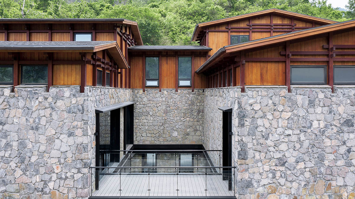 Penda China built resort with solid stones and wood structures evoking folk houses of China 