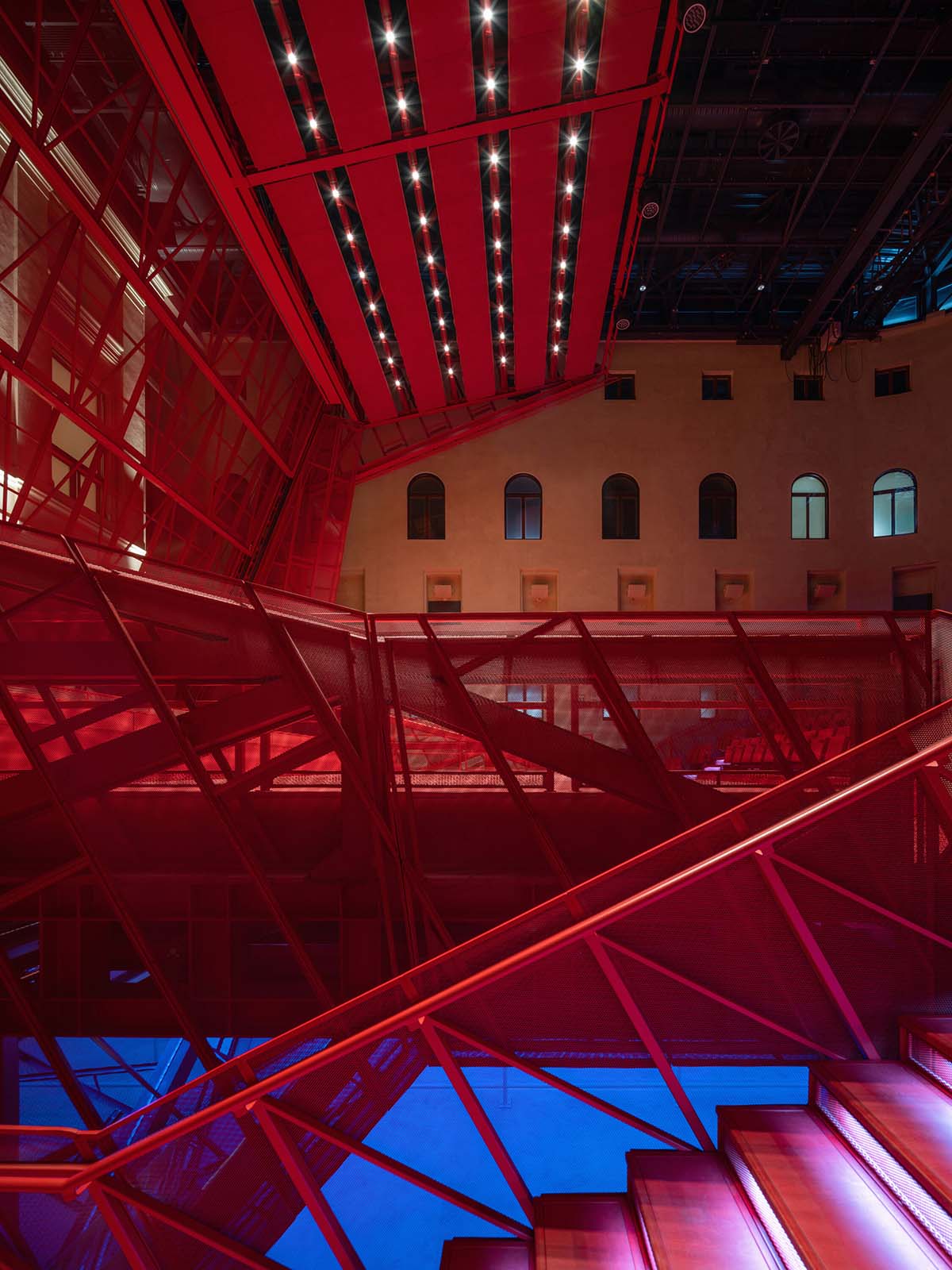 Bold red concert hall makes a statement as a harmonious blend of history and modern technology 