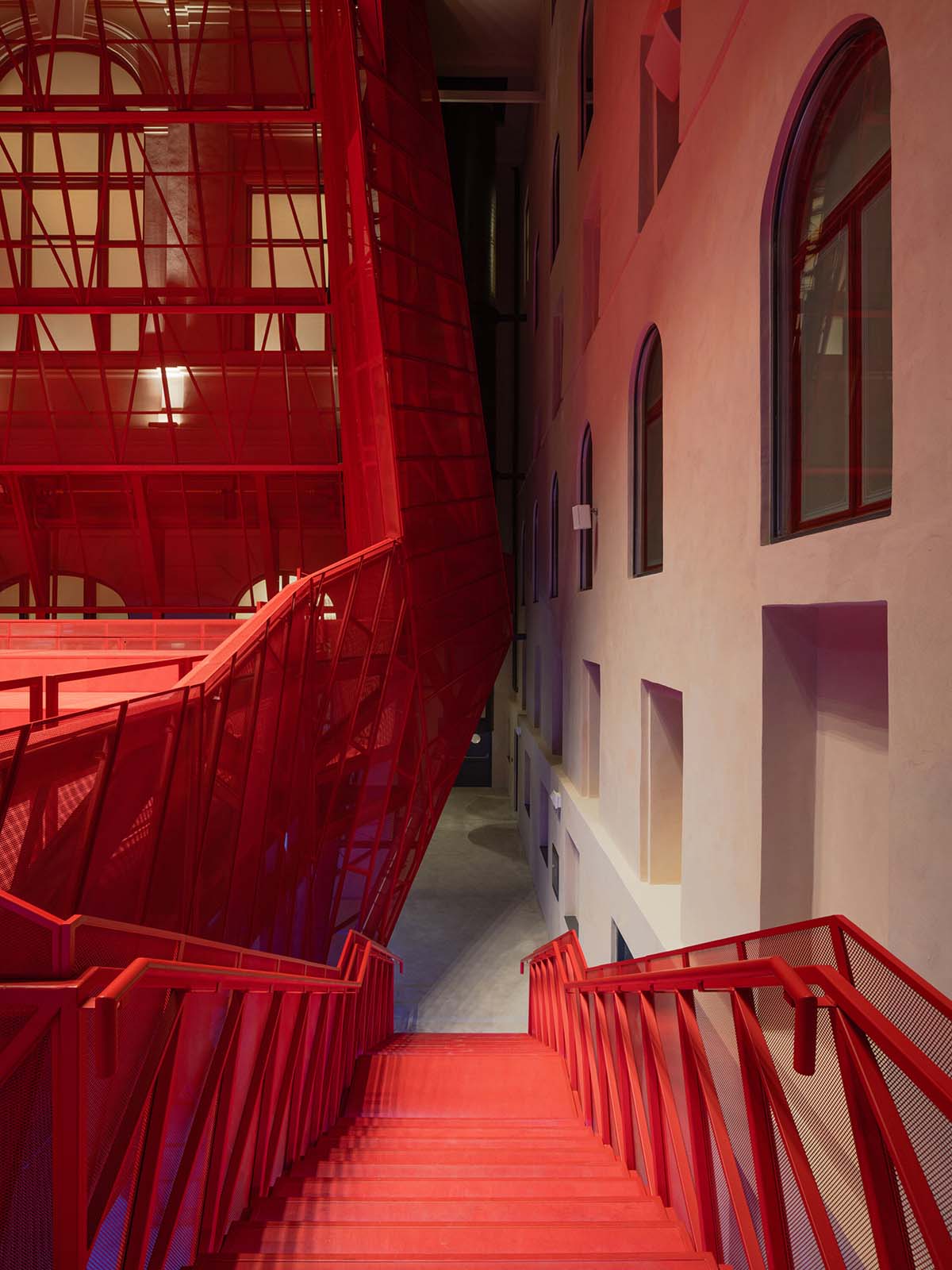 Bold red concert hall makes a statement as a harmonious blend of history and modern technology 