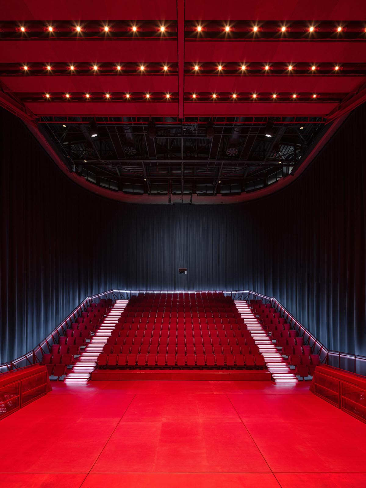 Bold red concert hall makes a statement as a harmonious blend of history and modern technology 