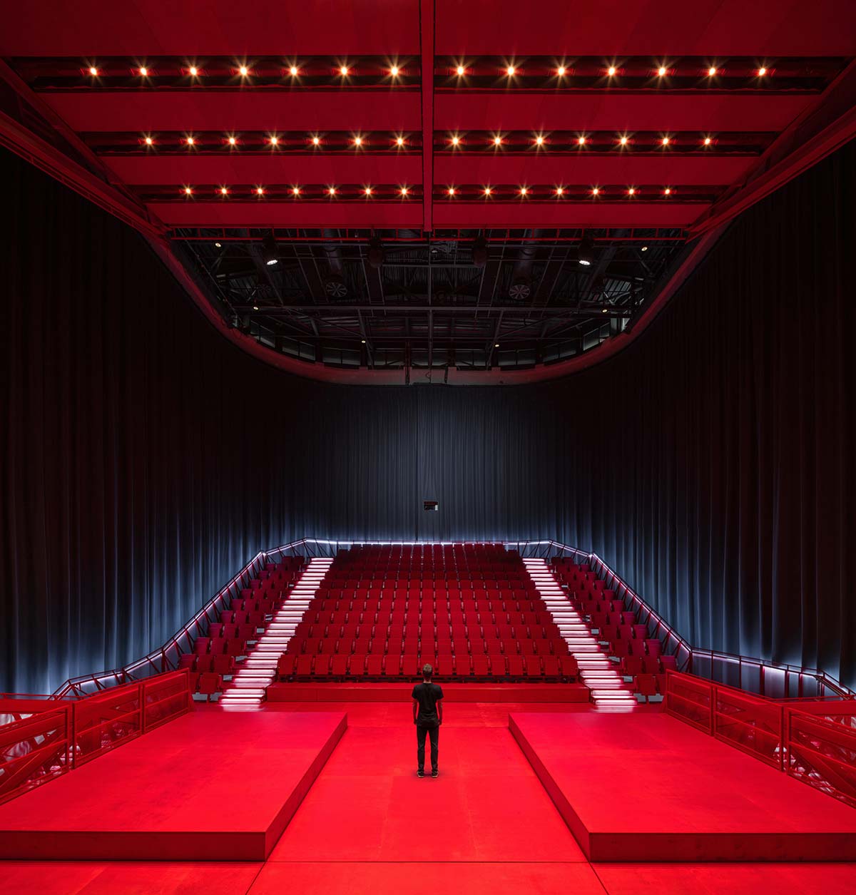 Bold red concert hall makes a statement as a harmonious blend of history and modern technology 