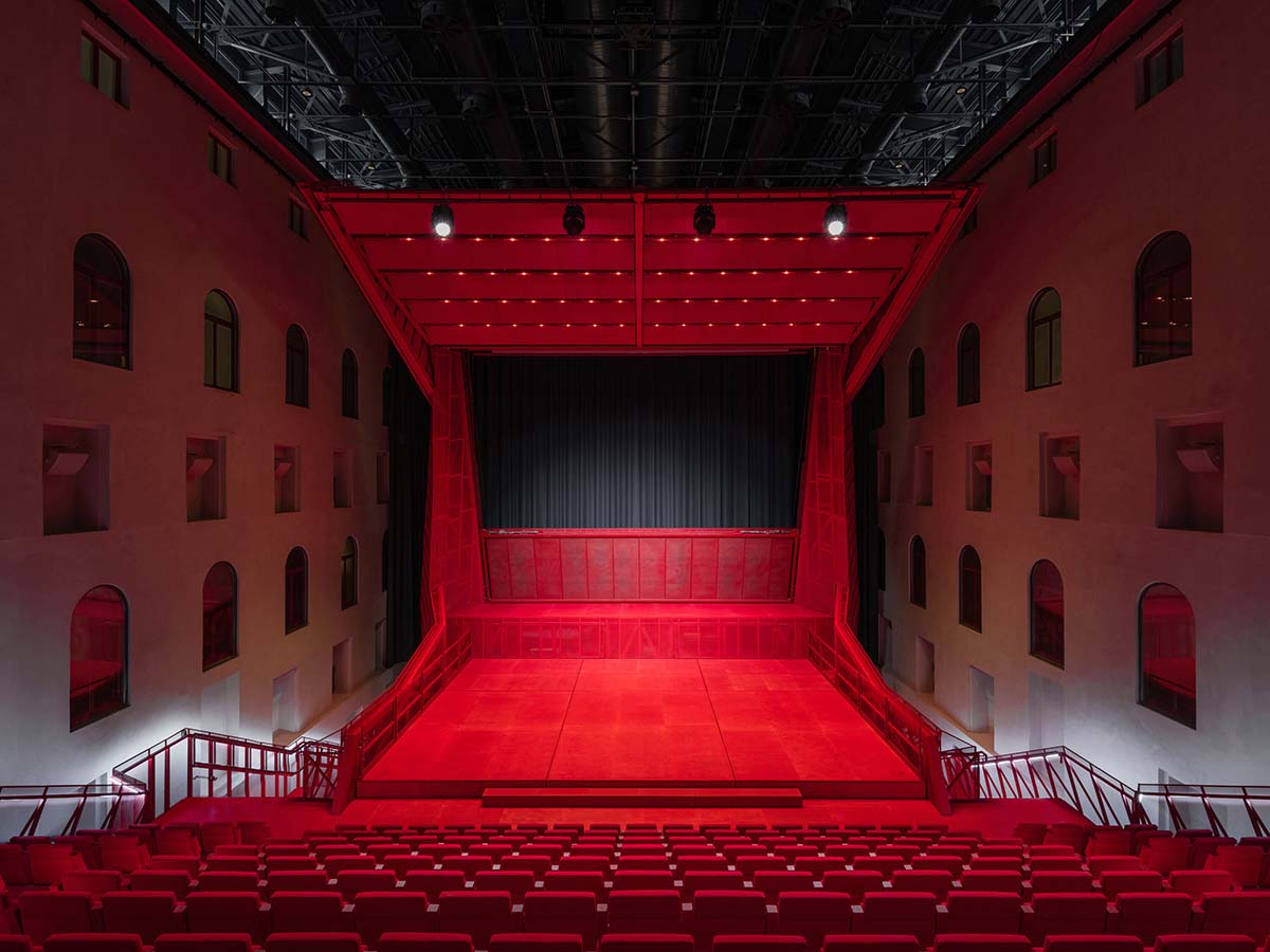 Bold red concert hall makes a statement as a harmonious blend of history and modern technology 