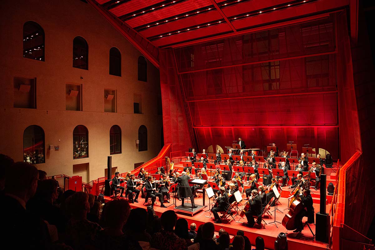 Bold red concert hall makes a statement as a harmonious blend of history and modern technology 
