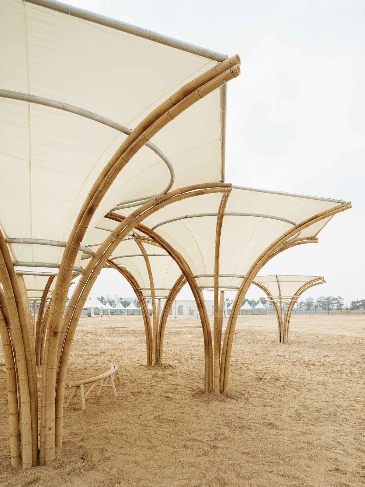 Also Architects creates art museum made of umbrella-like bamboo structures and undulating fabric