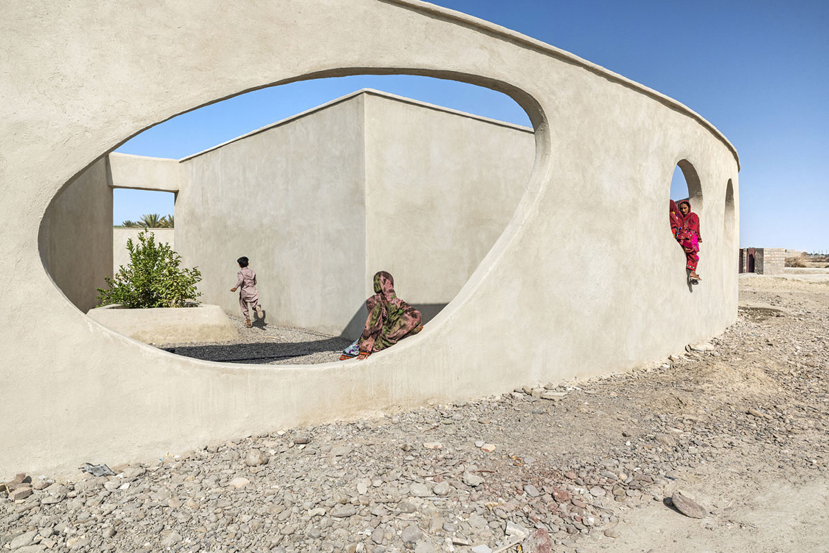 Circular wall featuring inhabitable holes encapsulates elementary school designed by Daaz Office