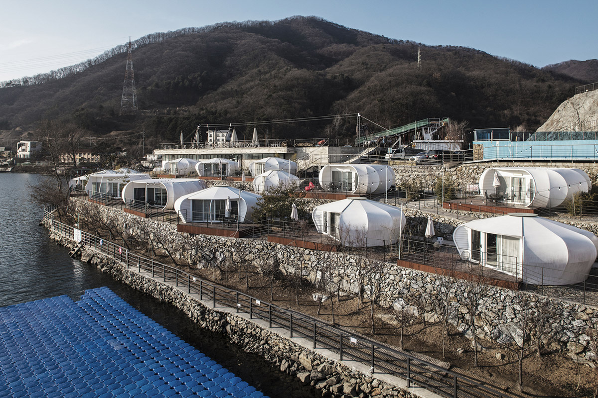 ArchiWorkshop combines oval guest rooms with museum in one landscape in South Korea