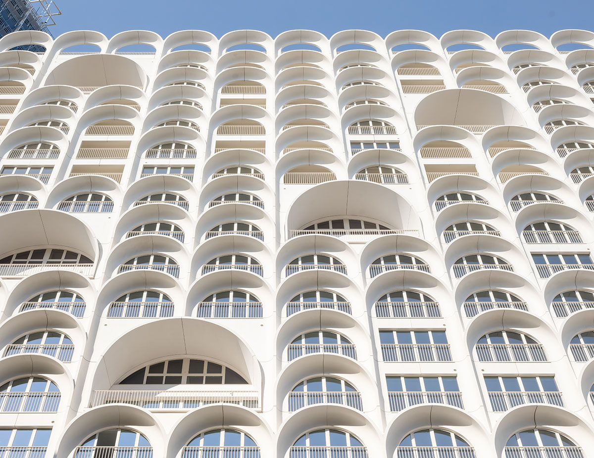 PietriArchitectes wraps residential tower with white concrete vaults referencing to the Mediterranean