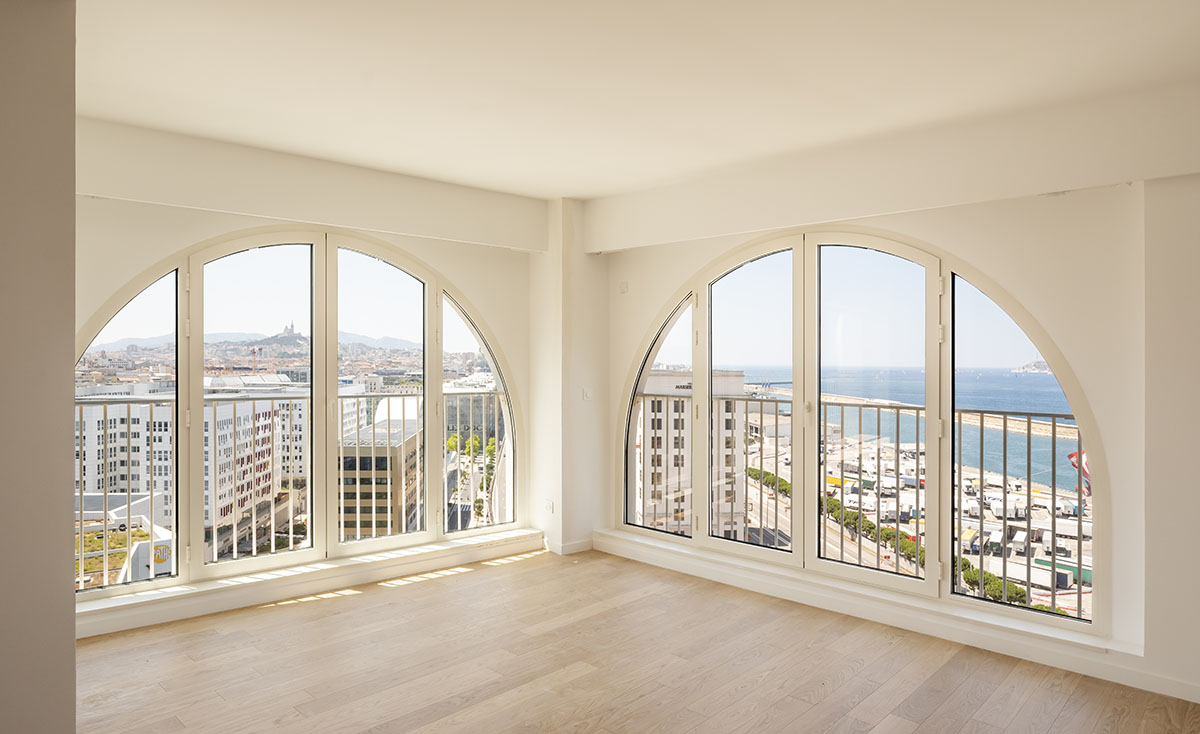 PietriArchitectes wraps residential tower with white concrete vaults referencing to the Mediterranean