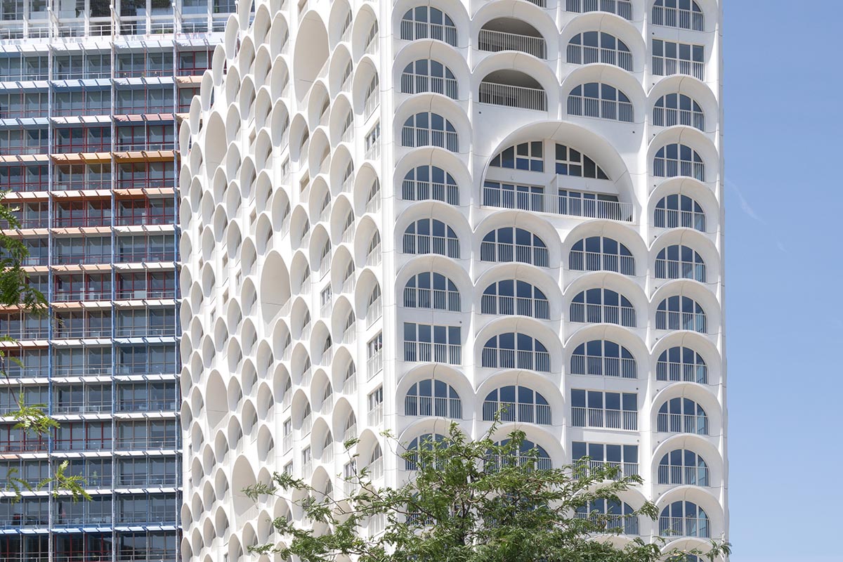PietriArchitectes wraps residential tower with white concrete vaults referencing to the Mediterranean