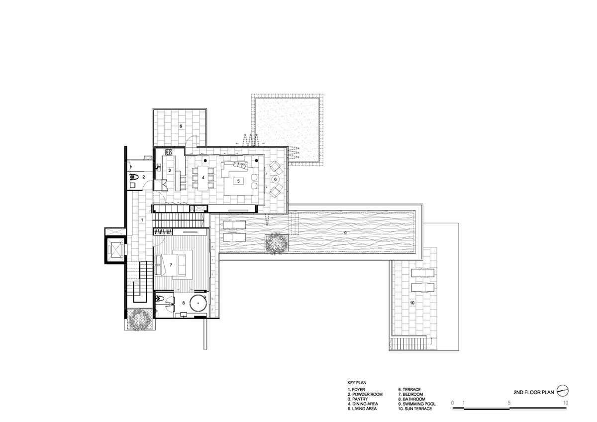 AAd built self-sustainable residence with perforated facade and steel rods in Thailand