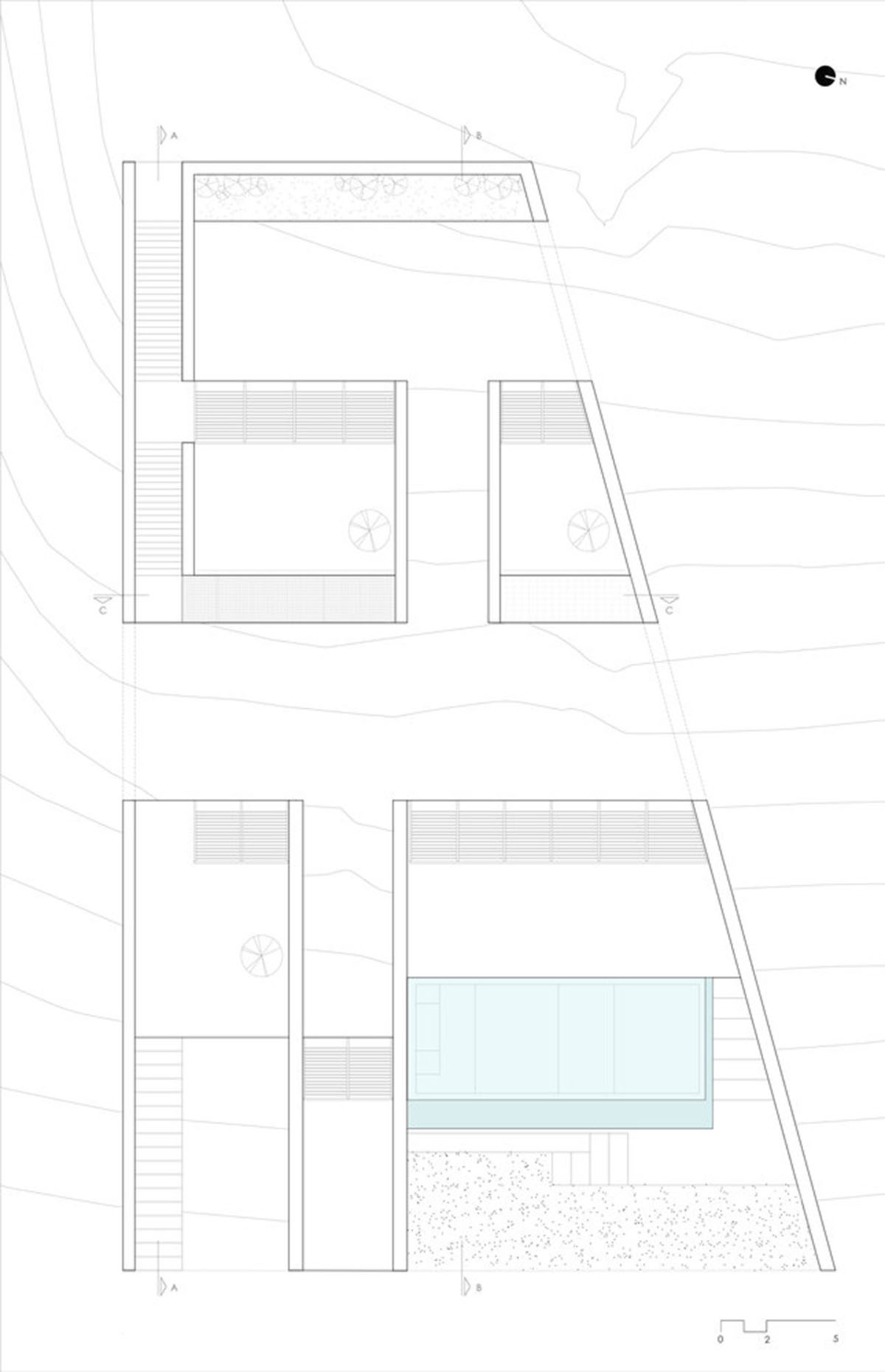 MOLD Architects used advantages of sloping land to design Ncaved house in Greece