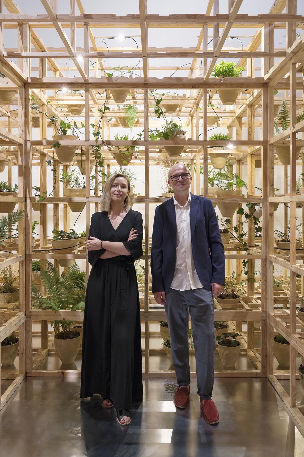 Polish Pavilion reveals wooden matrix installation with terracotta pots at Triennale Milano 2022
