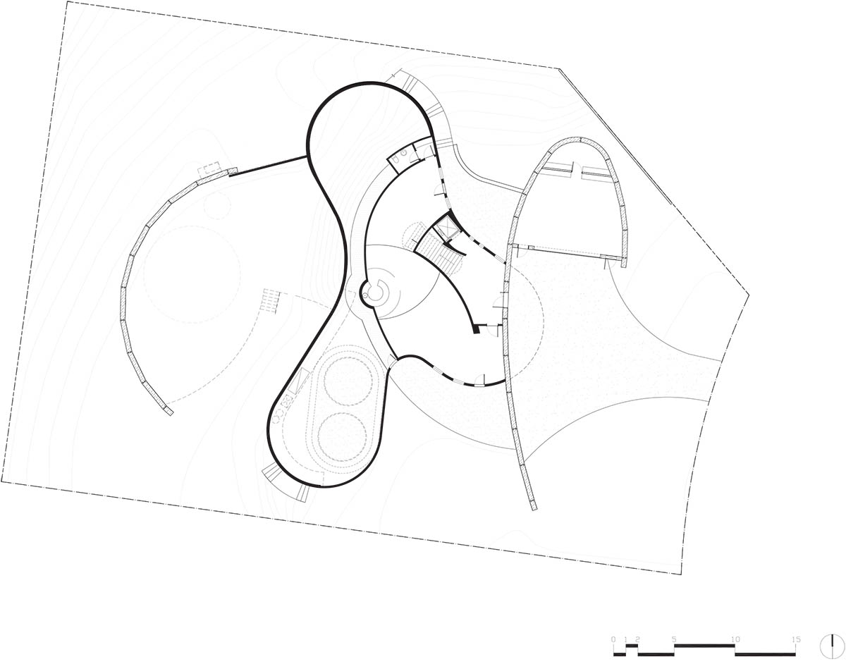 Wood Marsh built curvaceous home clad in dark timber contrasting its natural landscape in Portsea