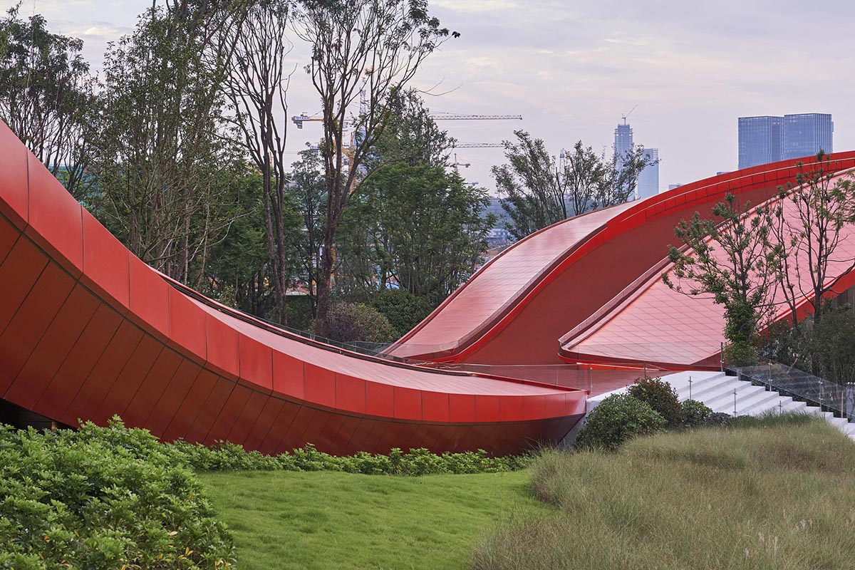 Sinuous red roof combines technology museum and reception center in Chengdu by Powerhouse Company