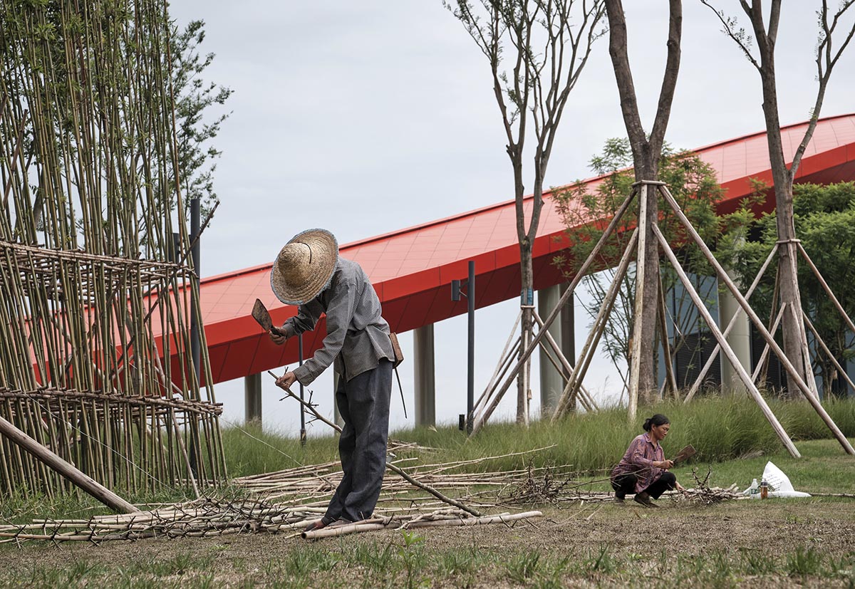 Sinuous red roof combines technology museum and reception center in Chengdu by Powerhouse Company