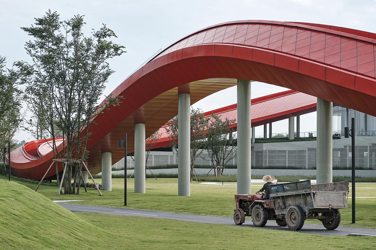 Sinuous red roof combines technology museum and reception center in Chengdu by Powerhouse Company