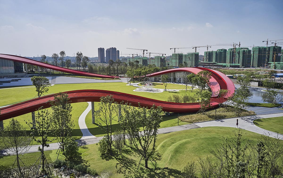 Sinuous red roof combines technology museum and reception center in Chengdu by Powerhouse Company
