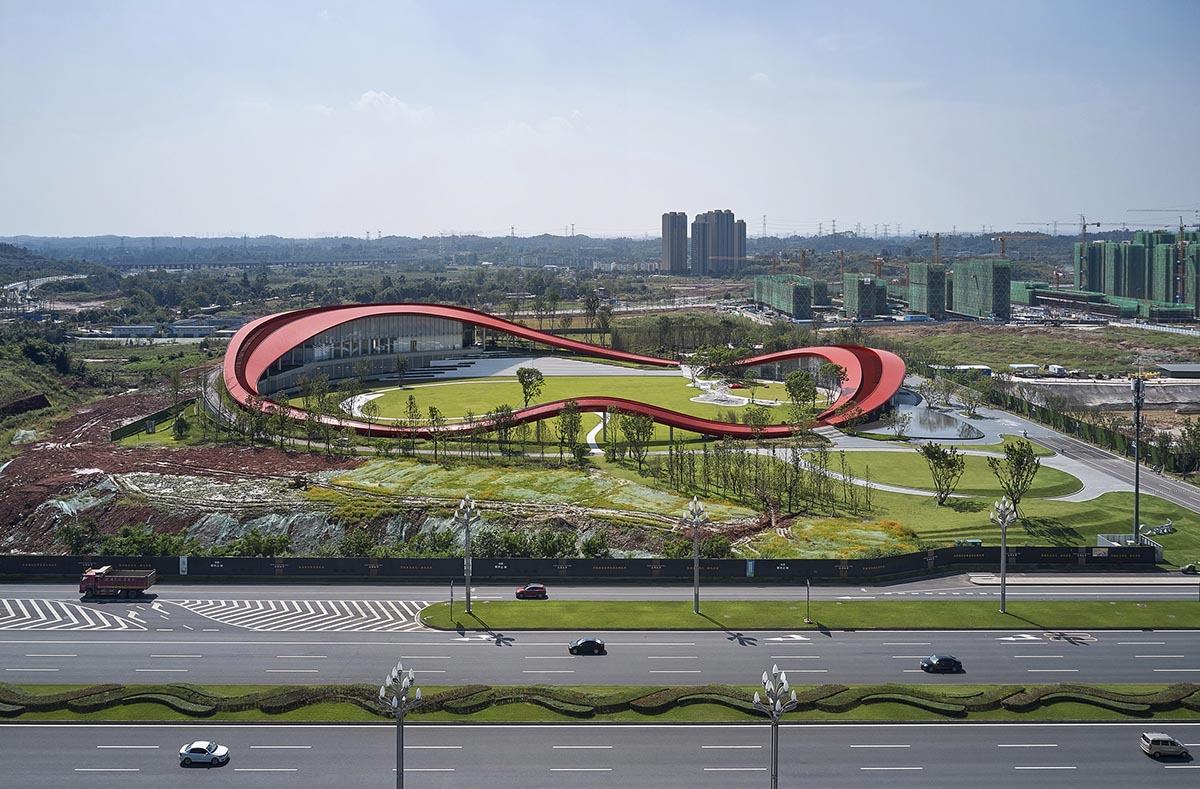 Sinuous red roof combines technology museum and reception center in Chengdu by Powerhouse Company