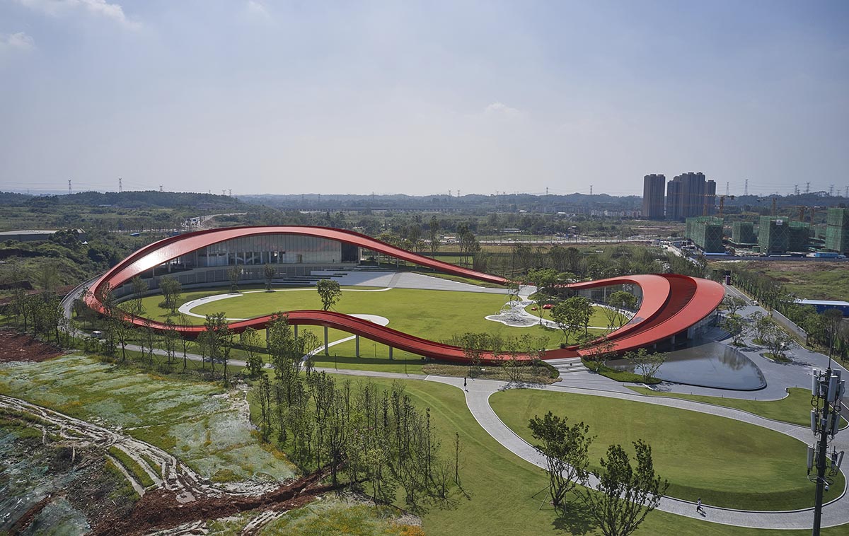 Sinuous red roof combines technology museum and reception center in Chengdu by Powerhouse Company