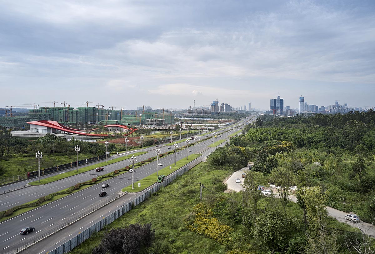 Sinuous red roof combines technology museum and reception center in Chengdu by Powerhouse Company